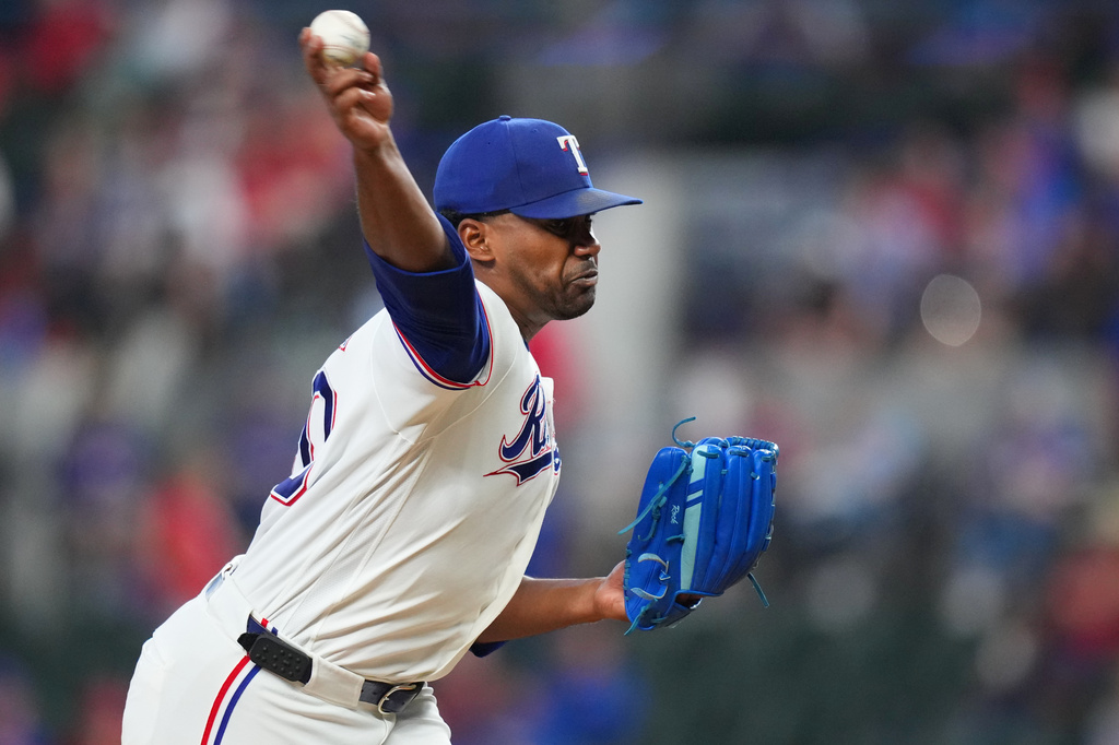 Texas Rangers starting pitcher Kumar Rocker throws to the New York Mets during the first inning of a baseball game Thursday, Sept. 24, 2026, in Arlington, Texas. (AP Photo/Julio Cortez)