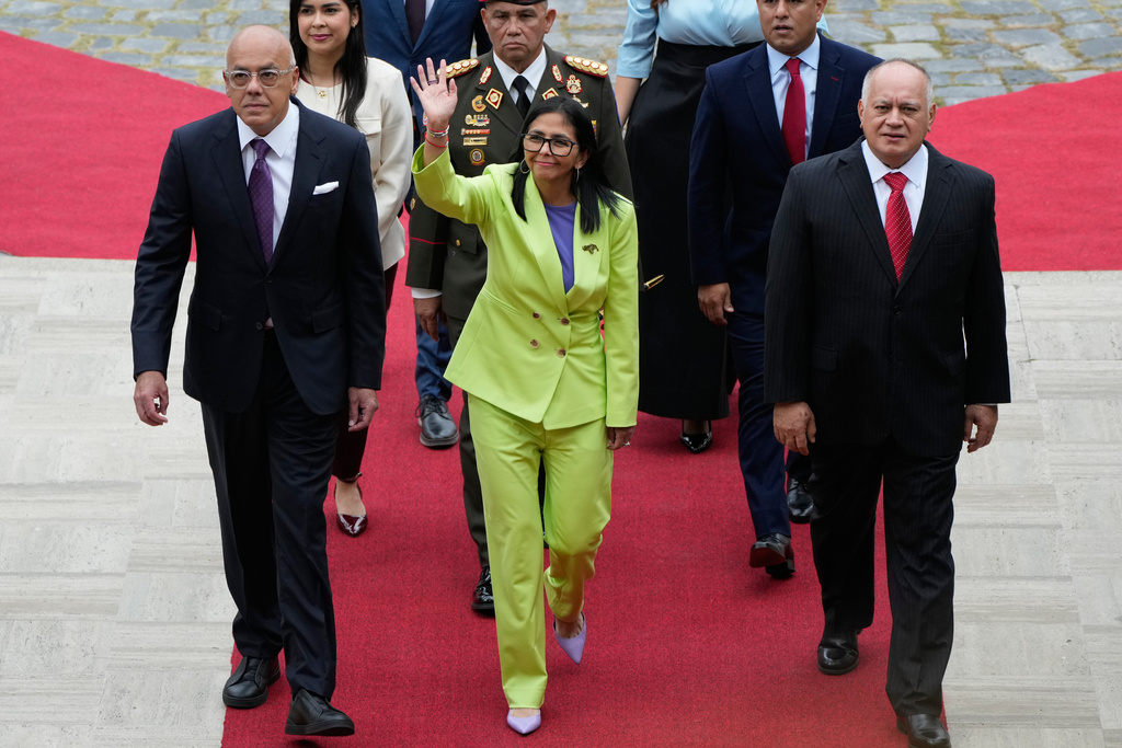 Venezuela's acting President Delcy Rodriguez, center, National Assembly President Jorge Rodriguez, left, and Interior Minister Diosdado Cabello arrive at the National Assembly in Caracas, Venezuela, Thursday, Jan. 15, 2026. (AP Photo/Ariana Cubillos)
