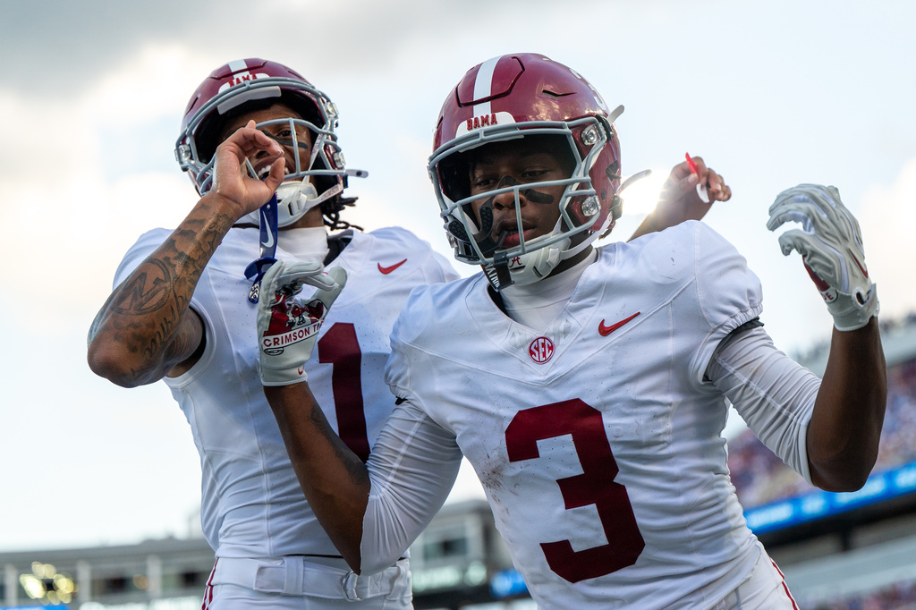 Alabama wide receiver Lotzeir Brooks (3) celebrates after a two-point conversion with wide receiver Ryan Coleman-Williams (1) during the second half of an NCAA college football game against Kentucky, Saturday, Sept. 12, 2026, in Lexington, Ky. (AP Photo/Tony Wagner)
