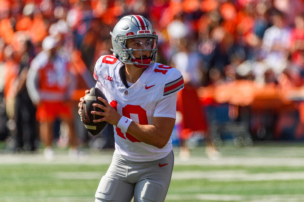Ohio State quarterback Julian Sayin (10) looks to pass during the first half of an NCAA college football game against Illinois, Saturday, Oct. 11, 2025, in Champaign, Ill. (AP Photo/Craig Pessman)