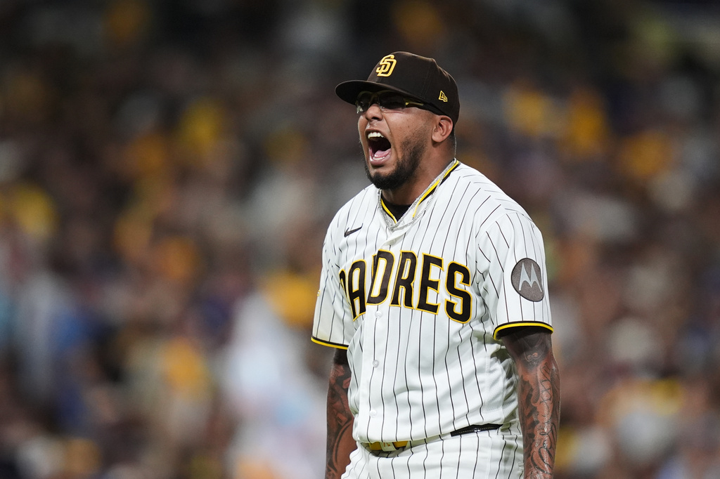 San Diego Padres pitcher Bradgley Rodriguez reacts after ending the fifth inning against the Chicago Cubs in Game 2 of the National League Wild Card baseball playoff series Wednesday, Sept. 30, 2026, in San Diego. (AP Photo/Gregory Bull)