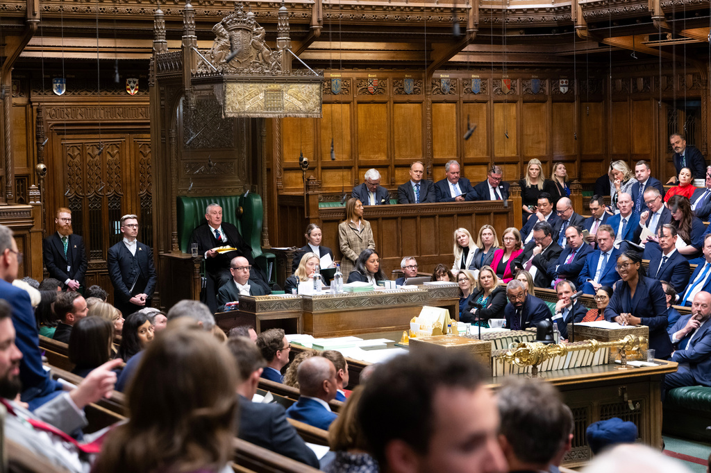 Sir Lindsay Hoyle MP, Speaker of the House of Commons, second left, looks on as Leader of Britain's Conservative party Kemi Badenoch speaks during a debate on a motion on Privileges in the House of Commons in London, Tuesday, April 28, 2026. (House of Commons via AP)
