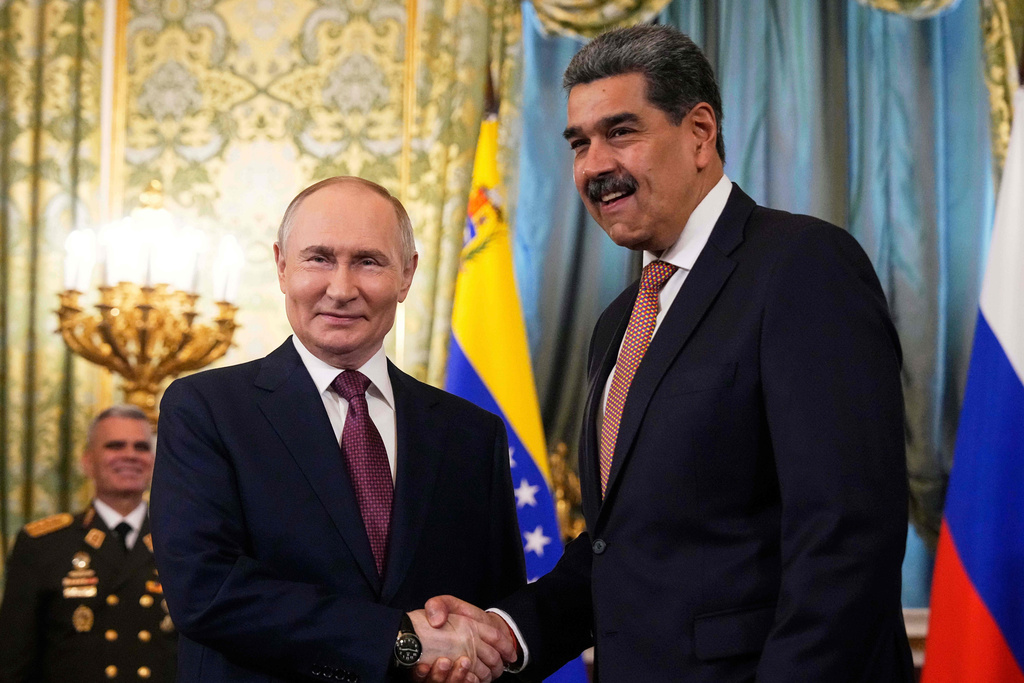 FILE - Russian President Vladimir Putin, left, shakes hands with Venezuelan President Nicolas Maduro during their meeting at the Kremlin in Moscow, Russia, Wednesday, May 7, 2025, ahead of celebrations of the 80th anniversary of the Soviet Union's victory over Nazi Germany during the World War II. (AP Photo/Alexander Zemlianichenko, file)