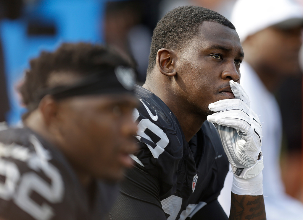 FILE - Oakland Raiders linebacker Aldon Smith (99) sits on the bench during the second half of the team's NFL football game against the Cincinnati Bengals in Oakland, Calif., on Sept. 13, 2015. (AP Photo/Ben Margot, File)