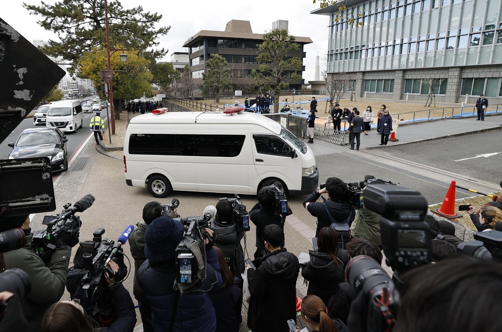 A vehicle carrying Tetsuya Yamagami, the defendant accused of fatally shooting Japan's former Prime Minister Shinzo Abe, enters the Nara District Court for his sentencing hearing in Nara, western Japan, Wednesday, Jan. 21, 2026. (Koki Ohada/Kyodo News via AP)