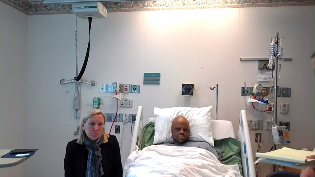 This image provided by Cambridge District Court, Tyler Brown appears in court via zoom from a hospital bed on Thursday, May 14, 2026 in Cambridge, Mass. (Cambridge District Court via AP)