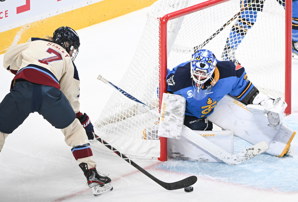 Montreal Victoire's Laura Stacey (7) moves in on Toronto Sceptres' goaltender Elaine Chuli (29) during the first period of a PWHL hockey game in Montreal, Saturday, Dec. 27, 2025. (Graham Hughes/The Canadian Press via AP)