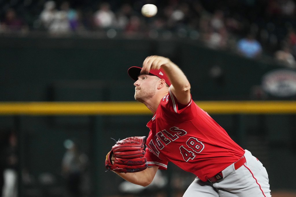 Los Angeles Angels pitcher Reid Detmers throws against the Arizona Diamondbacks in the first inning of a baseball game, Tuesday, June 16, 2026, in Phoenix. (AP Photo/Rick Scuteri)