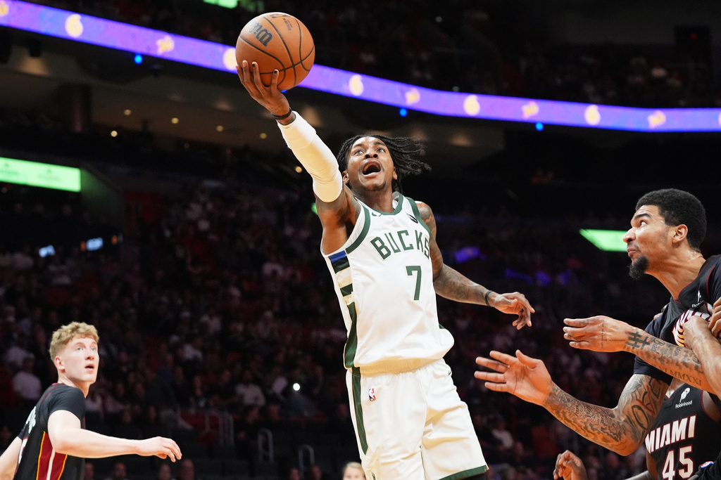 Milwaukee Bucks guard Kevin Porter Jr. (7) drives to the basket during the first half of an NBA basketball game against the Miami Heat Thursday, March 12, 2026, in Miami. (AP Photo/Marta Lavandier)