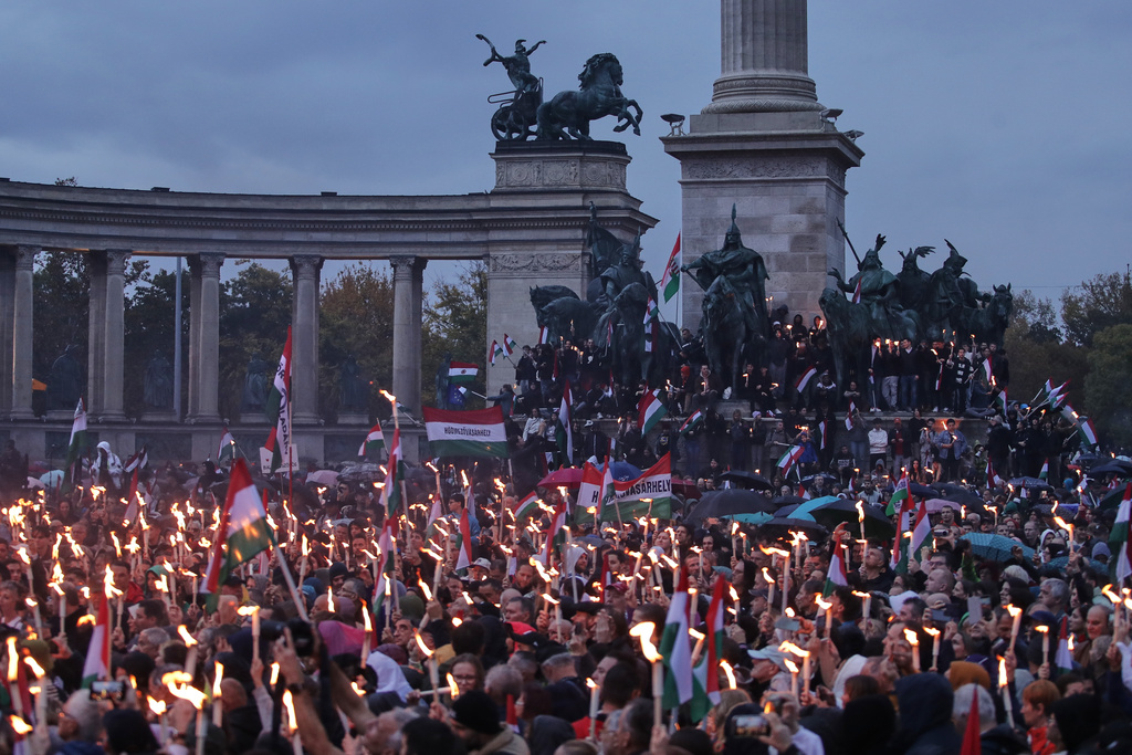 Demonstrators take part in a rally organized by the opposition TISZA party during celebrations marking the 69th anniversary of the outbreak of Hungary's 1956 revolution against communist rule and the Soviet Union, in Budapest, Hungary, Thursday, Oct. 23, 2025. (AP Photo/Rudolf Karancsi)
