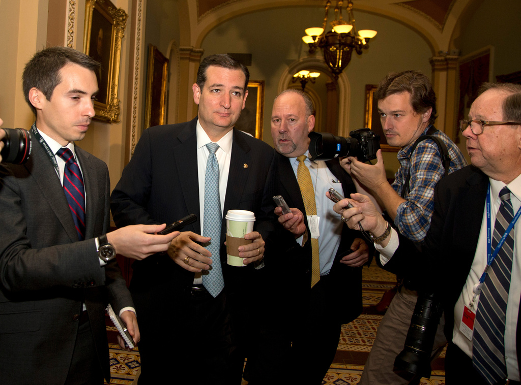 FILE - Sen. Ted Cruz, R-Texas, second left, is followed by reporters on Capitol Hill, Oct. 16, 2013, in Washington, as time grows short for Congress to prevent a threatened Treasury default and stop a partial government shutdown. (AP Photo/Carolyn Kaster, File)