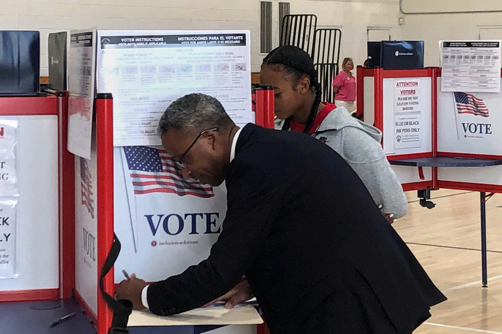 District of Columbia mayoral candidate Kenyan McDuffie fills out his ranked choice ballot during the D.C. primary election, Tuesday, June 16, 2026 in Washington. (AP Photo/Gary Fields)