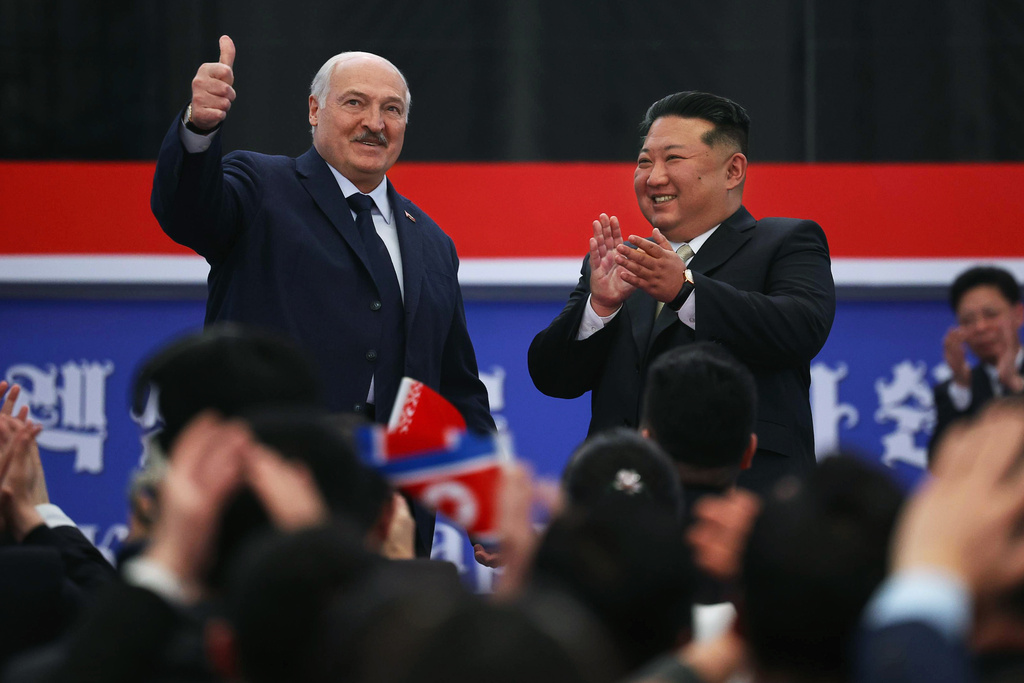 In this photo released by Belarus' Presidential Press Service, North Korea's leader Kim Jong Un, right, and Belarusian President Alexander Lukashenko gesture during their meeting in Pyongyang, North Korea, Thursday, March 26, 2026. (Belarus' Presidential Press Service via AP)