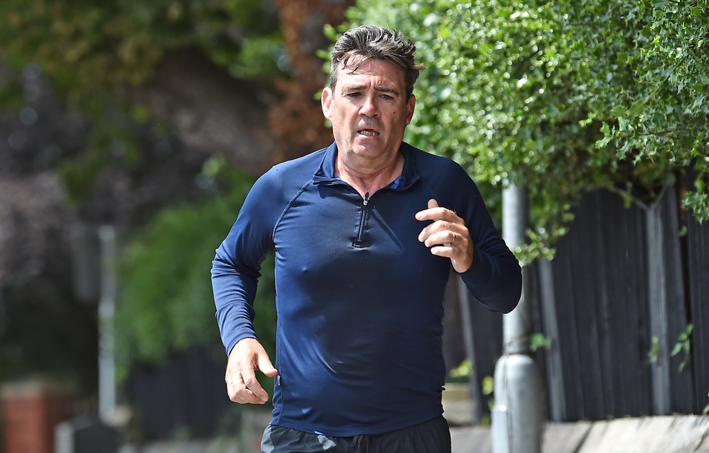Andy Burnham running near his house in Cheshire, England, Sunday, June 28, 2026. (Peter Powell/PA via AP)