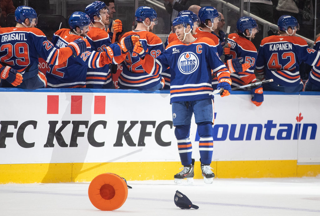 Edmonton Oilers' Connor McDavid (97) celebrates his hat trick goal against the Nashville Predators during the third period of an NHL game, in Edmonton, Tuesday, Jan. 6, 2026. (Jason Franson/The Canadian Press via AP)