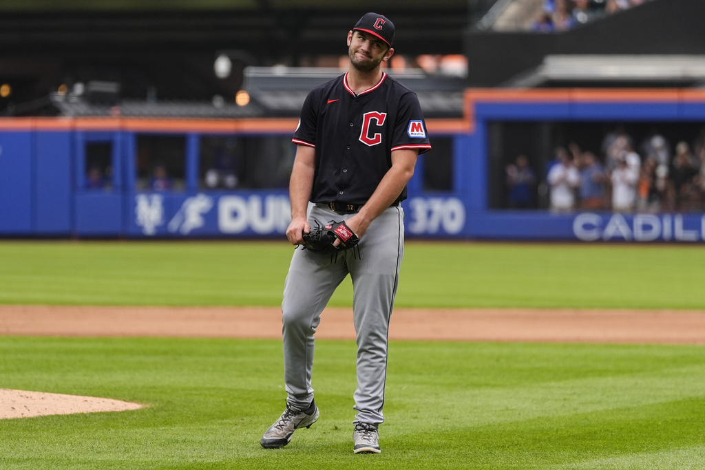 Cleveland Guardians pitcher Gavin Williams (32) reacts after giving up a hit during the ninth inning of a baseball game against the New York Mets, Wednesday, Aug. 6, 2025, in New York. (AP Photo/Yuki Iwamura)
