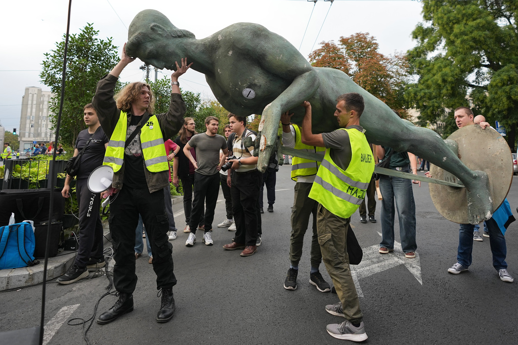 Students prepare a replica of the "Victor" monument, symbol of Belgrade, ahead of the "Student list - Students win" march to the Republic Election Commission towards participation in the upcoming parliamentary elections in Belgrade, Serbia, Monday, Sept. 14, 2026. (AP Photo/Darko Vojinovic)