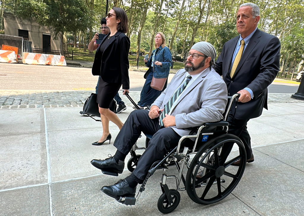 Former cargo ship captain John Merrone is wheeled out of federal court in the Brooklyn borough of New York by his lawyer, Bruce Barket, Wednesday, July 15, 2026, after pleading guilty to charges he drugged and sexually assaulted a U.S. Merchant Marine Academy cadet in 2019 while she was working on the vessel. (AP Photo/Michael R. Sisak)