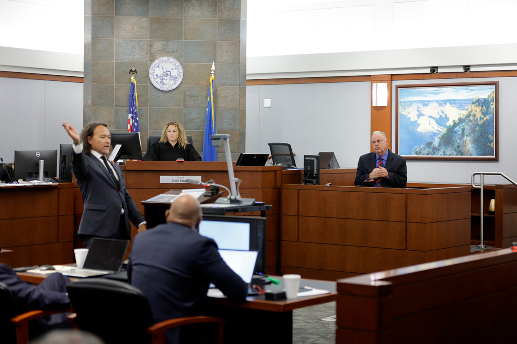 Michael Sanft, attorney for Duane Davis, left, asks a question to Garry Dale, a former Las Vegas Metro Police Department officer, during the Duane Davis murder trial, related to the 1996 killing of rapper Tupac Shakur, at Clark County District Court Regional Justice Center in Las Vegas,, Monday, Aug. 17, 2026. (Steve Marcus/Pool Photo via AP)