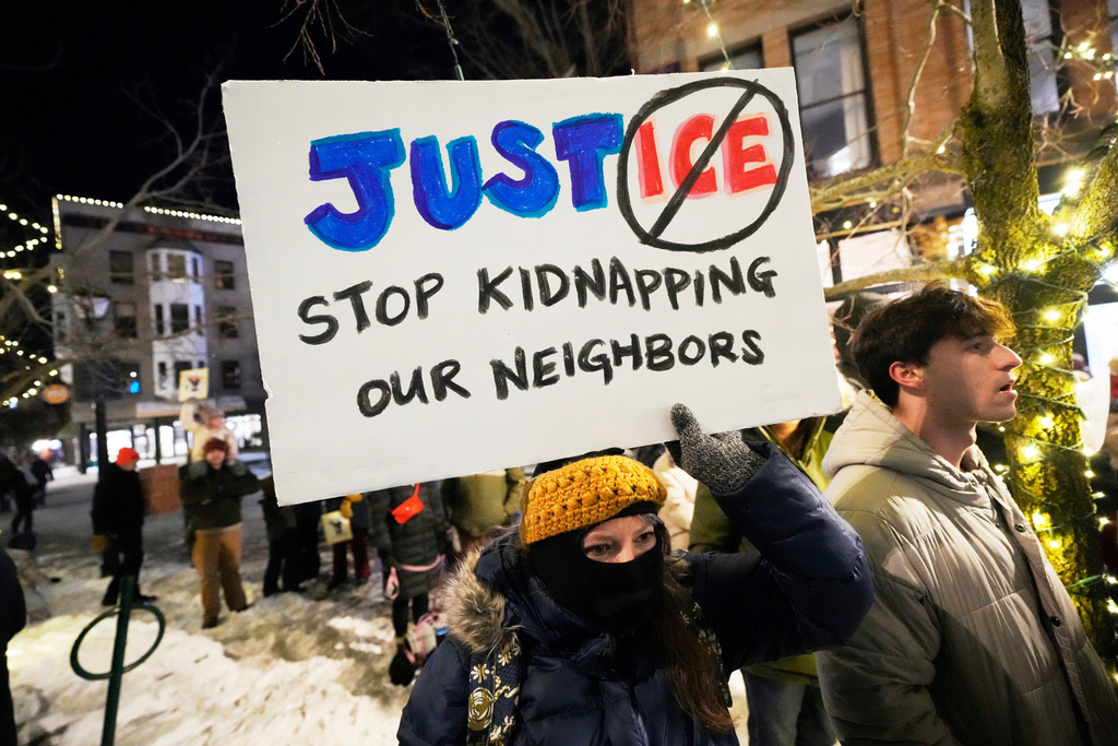 Protesters rally against the presence of U.S. Immigration Customs Enforcement in Maine, Friday, Jan. 23, 2026, in Portland, Maine. (AP Photo/Robert F. Bukaty)