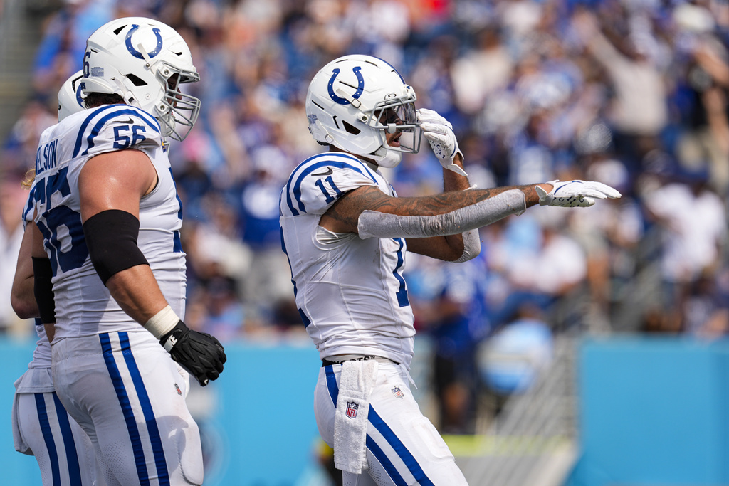 Indianapolis Colts wide receiver Michael Pittman (11) celebrates a touchdown against the Tennessee Titans during the second half of an NFL football game Sunday, Sept. 21, 2025, in Nashville, Tenn. (AP Photo/George Walker IV)
