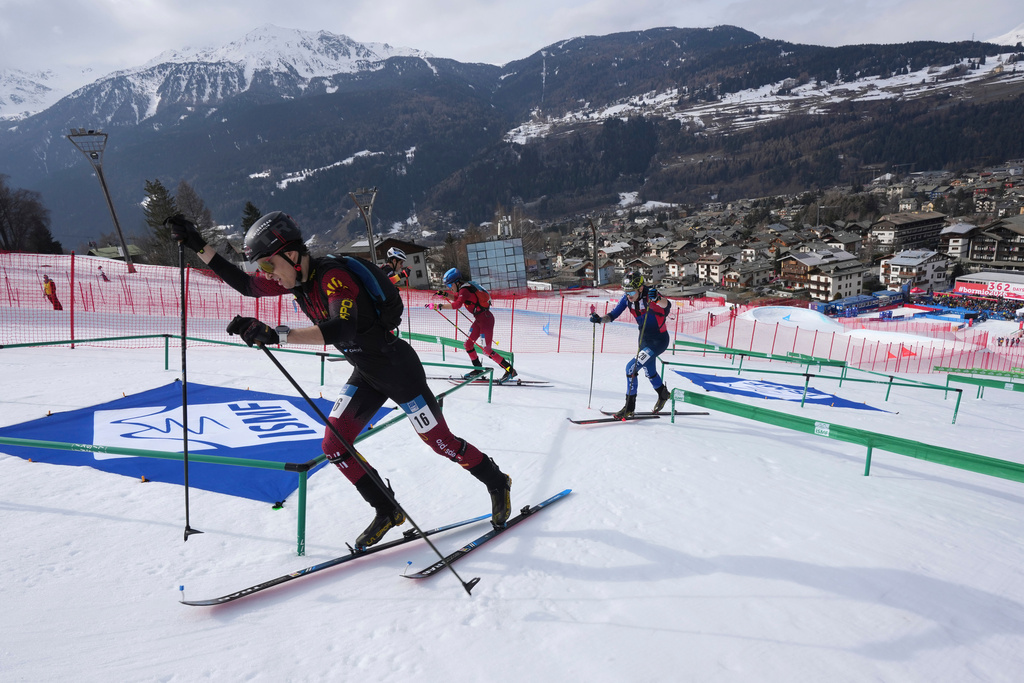 FILE - Athletes compete during the men's sprint race at the Ski Mountaineering World Cup event in Bormio, Italy, Saturday, Feb. 22, 2025. (AP Photo/Antonio Calanni, File)