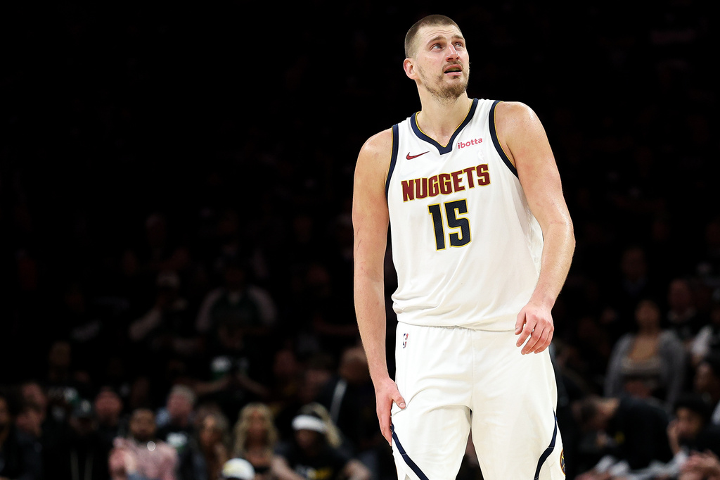 Denver Nuggets center Nikola Jokic (15) looks on during the second half of Game 6 of a first-round NBA basketball playoffs series against the Minnesota Timberwolves, Thursday, April 30, 2026, in Minneapolis. (AP Photo/Matt Krohn)