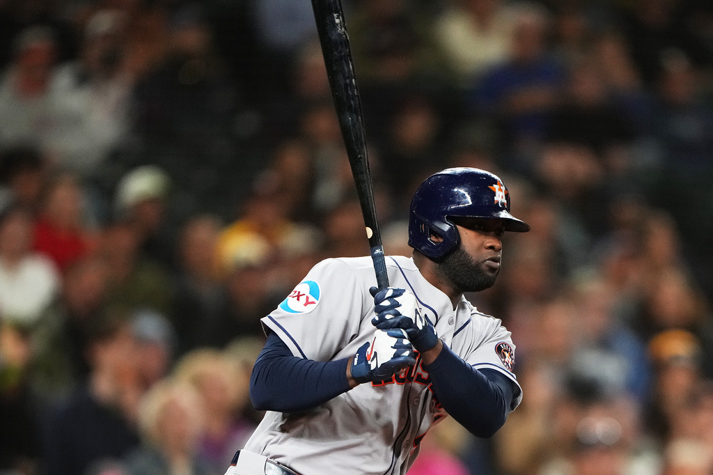 Houston Astros' Yordan Alvarez follows through on a double against the Seattle Mariners during the third inning of a baseball game, Wednesday, Sept. 23, 2026, in Seattle. (AP Photo/Lindsey Wasson)