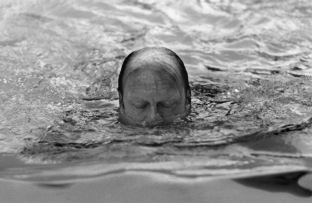FILE - his Aug. 11, 1974, file photo shows U.S. President Gerald Ford surfacing for air while swimming in the pool at his home in Alexandria, Va. (AP Photo/Chick Harrity)