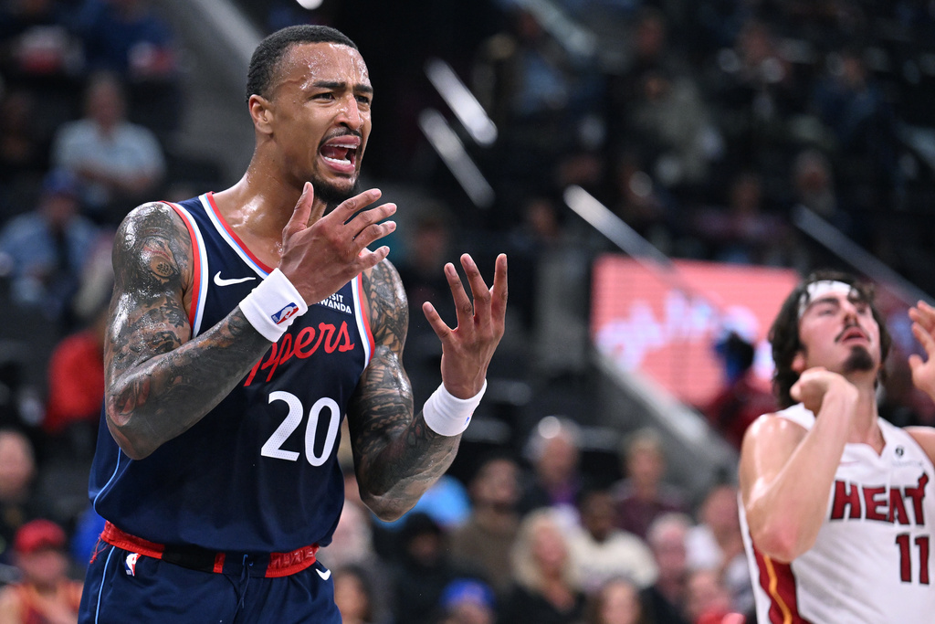 Los Angeles Clippers forward John Collins (20) argues with a referee after fouling a player from the Miami Heat during the first half of an NBA basketball game, Monday, Nov. 3, 2025, in Los Angeles. (AP Photo/Wally Skalij)