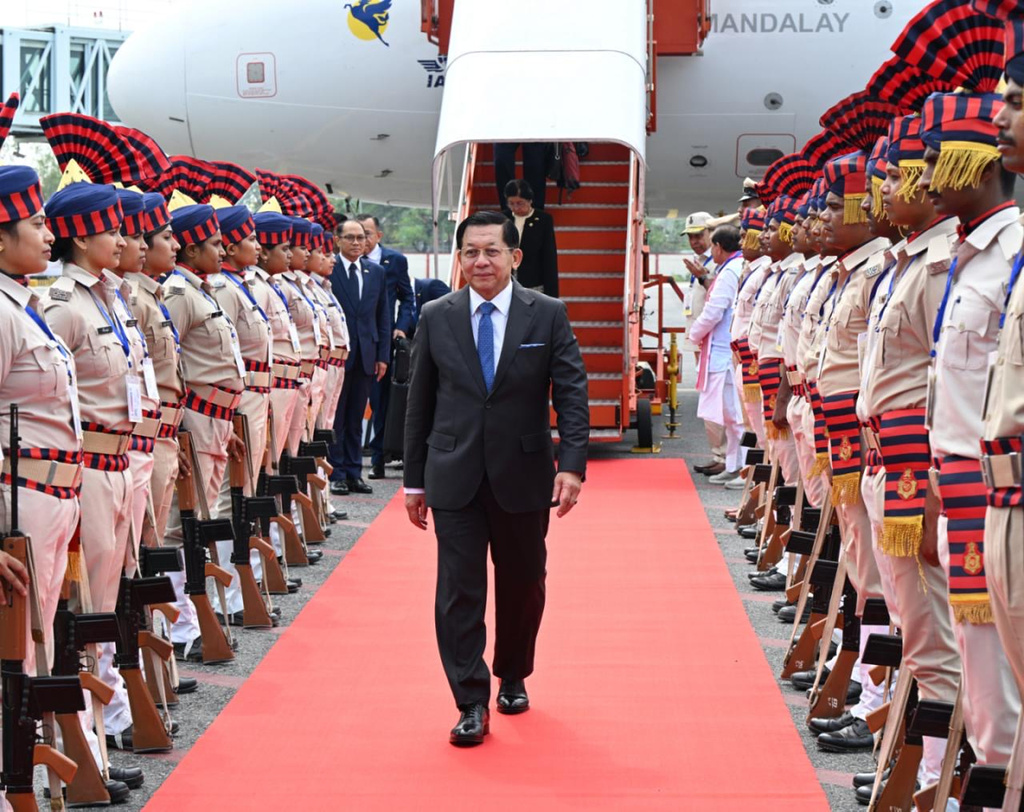 In this photo provided by Myanmar Military True News Information Team on Saturday, May 30, 2026, Myanmar President Min Aung Hlaing, center, inspects guard of honors upon arrival at Gaya airport, near Bodh Gaya, India on May 30. (Myanmar Military True News Information Team via AP)