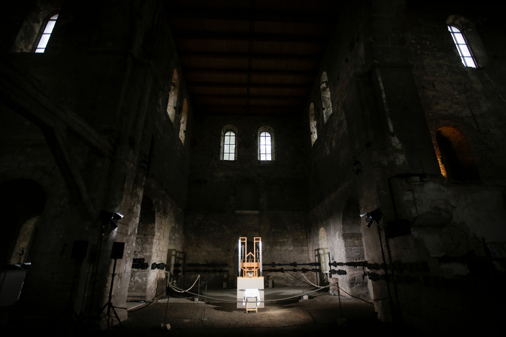 FILE - The organ of the John Cage organ project is illuminated prior to a 'sound change' at the Buchardi Church in Halberstadt, Germany, Sept. 5, 2020. (AP Photo/Markus Schreiber, File)
