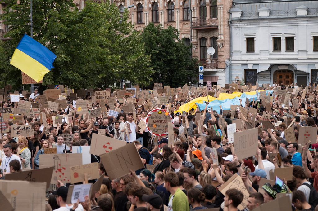 People gather to denounce President Volodymyr Zelenskyy's decision to dismiss Defense Minister Mykhailo Fedorov after six months in the post, Kyiv, Ukraine, Sunday, July 19, 2026. (AP Photo/Dan Bashakov)