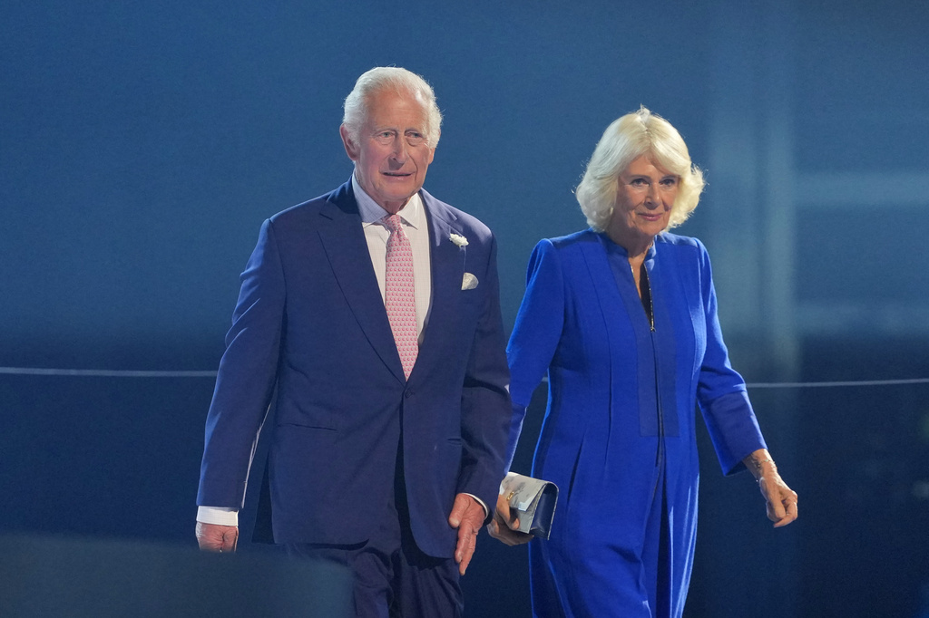 FILE - Britain's King Charles and Queen Camilla arrive for the Commonwealth Games opening ceremony in Glasgow, Scotland, July 23, 2026. (AP Photo/Kin Cheung, File)