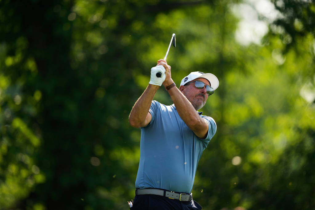 FILE - Phil Mickelson tees off on the 13th hole during the first round of the U.S. Open golf tournament at Oakmont Country Club, June 12, 2025, in Oakmont, Pa. (AP Photo/Carolyn Kaster, File)