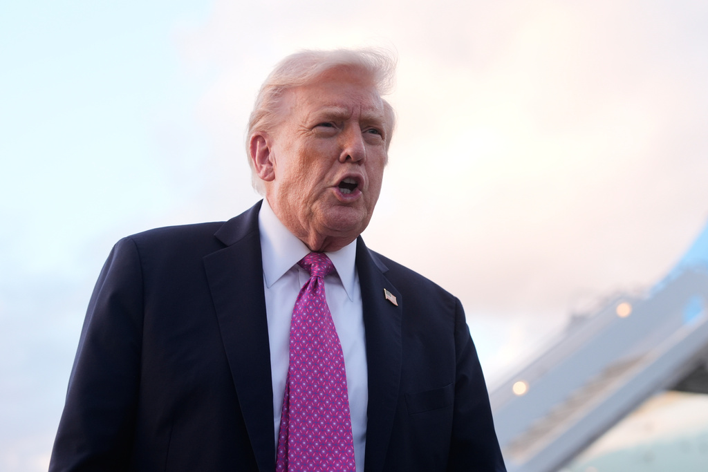 President Donald Trump speaks to reporters after arriving on Air Force One, Friday, Oct. 17, 2025, at Palm Beach International Airport in West Palm Beach, Fla. (AP Photo/Mark Schiefelbein)