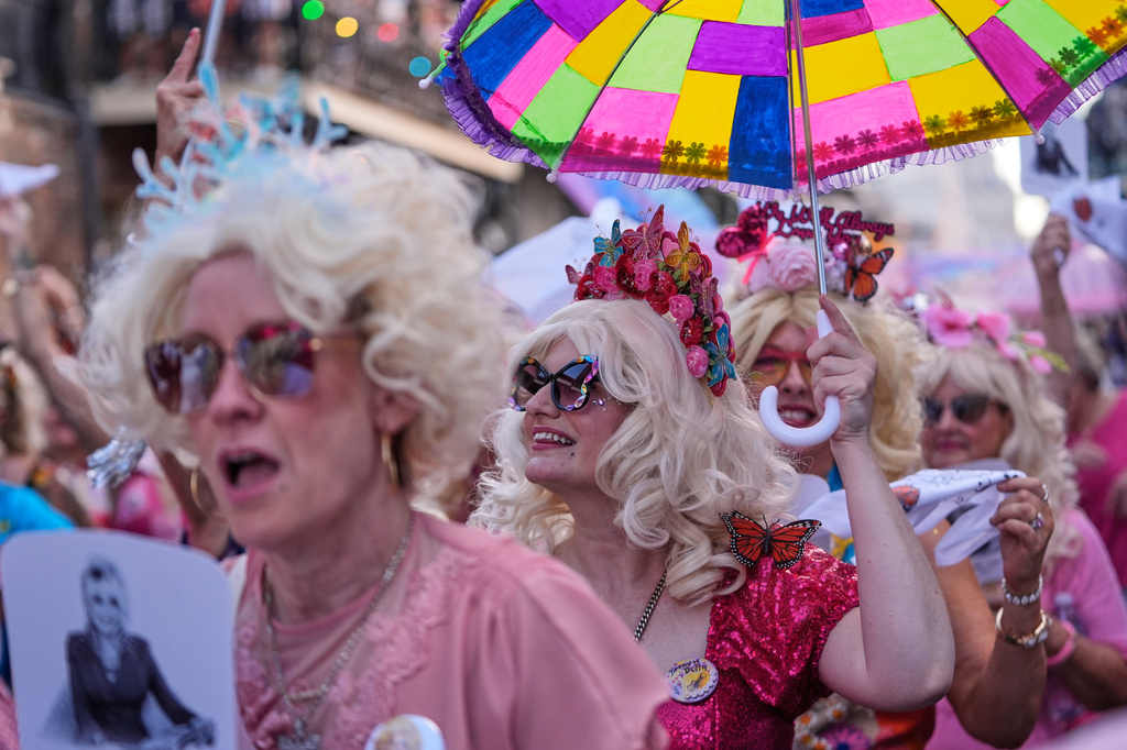 Members of the Krewe of Dolly lead a second line parade in commemoration of the life of Dolly Parton through the French Quarter Friday, Sept. 25, 2026, in New Orleans. (AP Photo/Gerald Herbert)