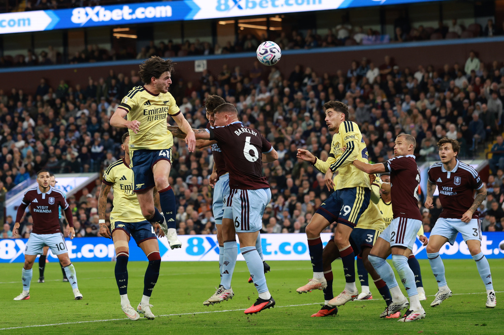 Arsenal's Declan Rice heads the ball during the English Premier League soccer match between Aston Villa and Arsenal in Birmingham, England, Monday, Aug. 31, 2026. (AP Photo/Morgan Harlow)