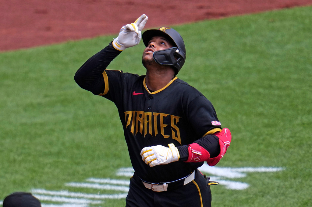 Pittsburgh Pirates' Esmerlyn Valdez celebrates as he rounds the bases after hitting a solo home run off Milwaukee Brewers pitcher Brandon Sproat during the third inning of the first game of a baseball doubleheader in Pittsburgh, Saturday, July 11, 2026. (AP Photo/Gene J. Puskar)
