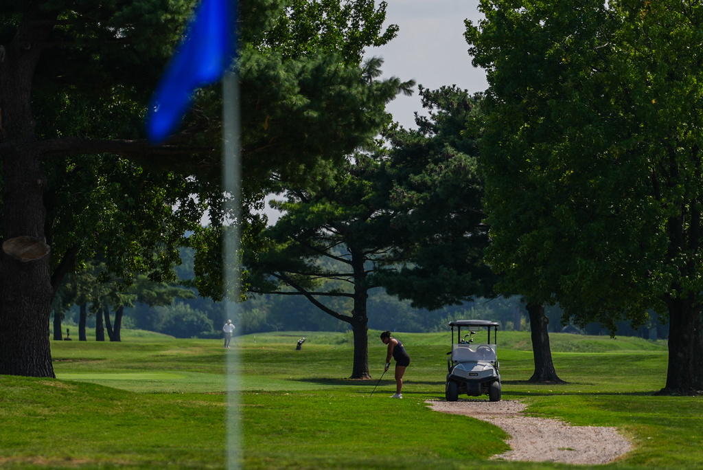 A person golfs at East Potomac Park Golf Course, Tuesday, Sept. 1, 2026, in Washington. (AP Photo/Julia Demaree Nikhinson)