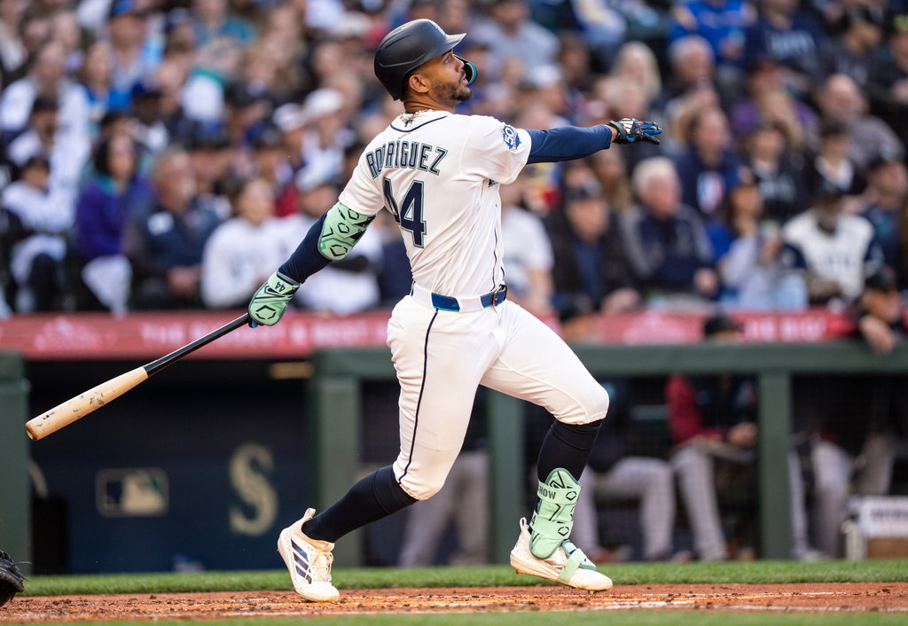 Seattle Mariners' Julio Rodriguez hits a solo home run during the third inning of a baseball game against the Arizona Diamondbacks, Saturday, May 30, 2026, in Seattle. (AP Photo/Stephen Brashear)