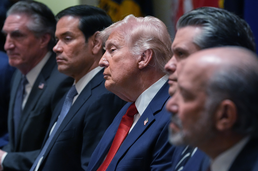 From left, Interior Secretary Doug Burgum, Secretary of State Marco Rubio, President Donald Trump, Defense Secretary Pete Hegseth, and Commerce Secretary Howard Lutnick listen during a Cabinet meeting at the White House, Thursday, March 26, 2026, in Washington. (AP Photo/Alex Brandon)