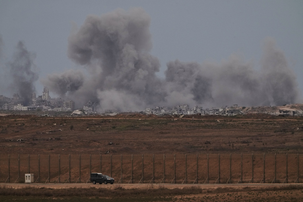 Smoke rises to the sky following an Israeli military strike in the Gaza Strip, as seen from southern Israel, Thursday, Oct. 9, 2025, following the announcement that Israel and Hamas have agreed to the first phase of a peace plan to pause the fighting. (AP Photo/Ariel Schalit)
