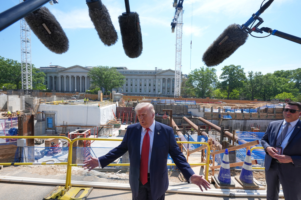President Donald Trump tours Ballroom construction around the outside the White House, Tuesday, May 19, 2026, in Washington. (AP Photo/Jacquelyn Martin)