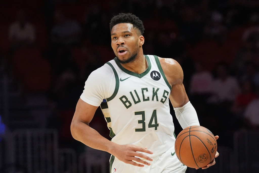 FILE - Milwaukee Bucks forward Giannis Antetokounmpo (34) dribbles the ball during the first half of an NBA basketball game against the Miami Heat, March 12, 2026, in Miami. (AP Photo/Marta Lavandier, File)