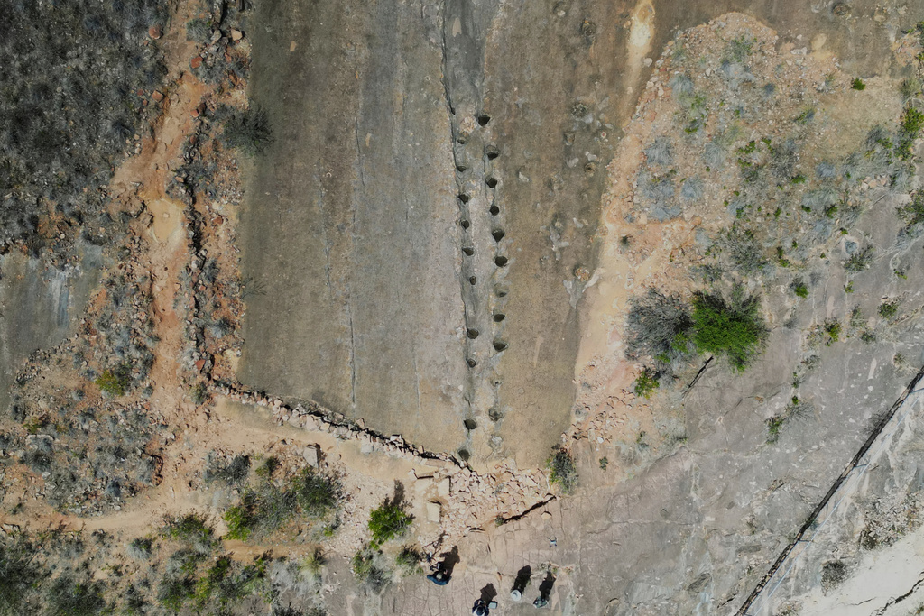 Petrified footprints by dinosaurs are visible in Carreras Pampa in Toro Toro National Park, north of Potosi, Bolivia, Saturday, Dec. 6, 2025. (AP Photo/Juan Karita)
