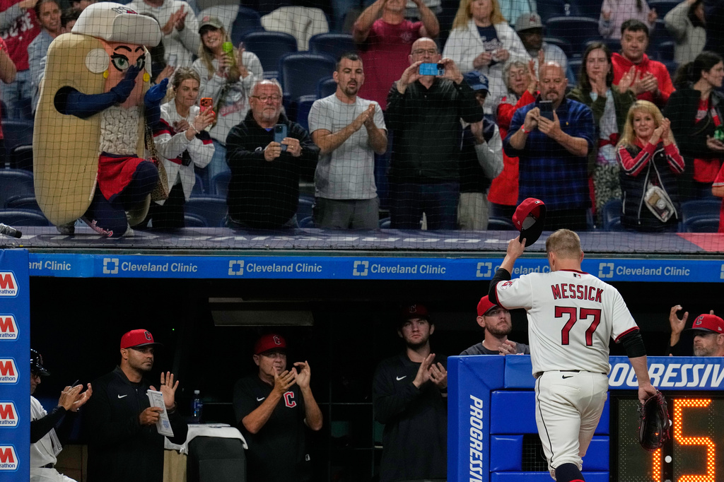 Cleveland Guardians pitcher Parker Messick (77) tips his hat to the crowd as he is taken out of the game in the nintgh inning of a baseball game against the Baltimore Orioles in Cleveland, Thursday, April 16, 2026. (AP Photo/Sue Ogrocki)