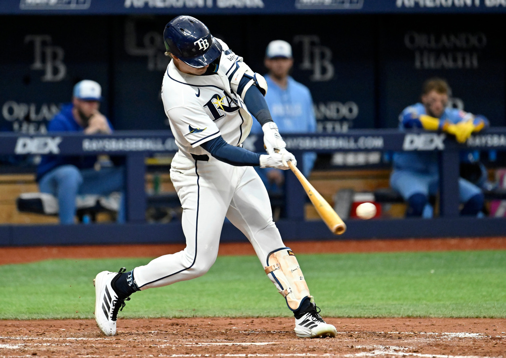 Tampa Bay Rays' Jonny DeLuca hits an RBI double during the fourth inning of a baseball game against the Kansas City Royals Wednesday, June 24, 2026, in St. Petersburg, Fla. (AP Photo/Jason Behnken)