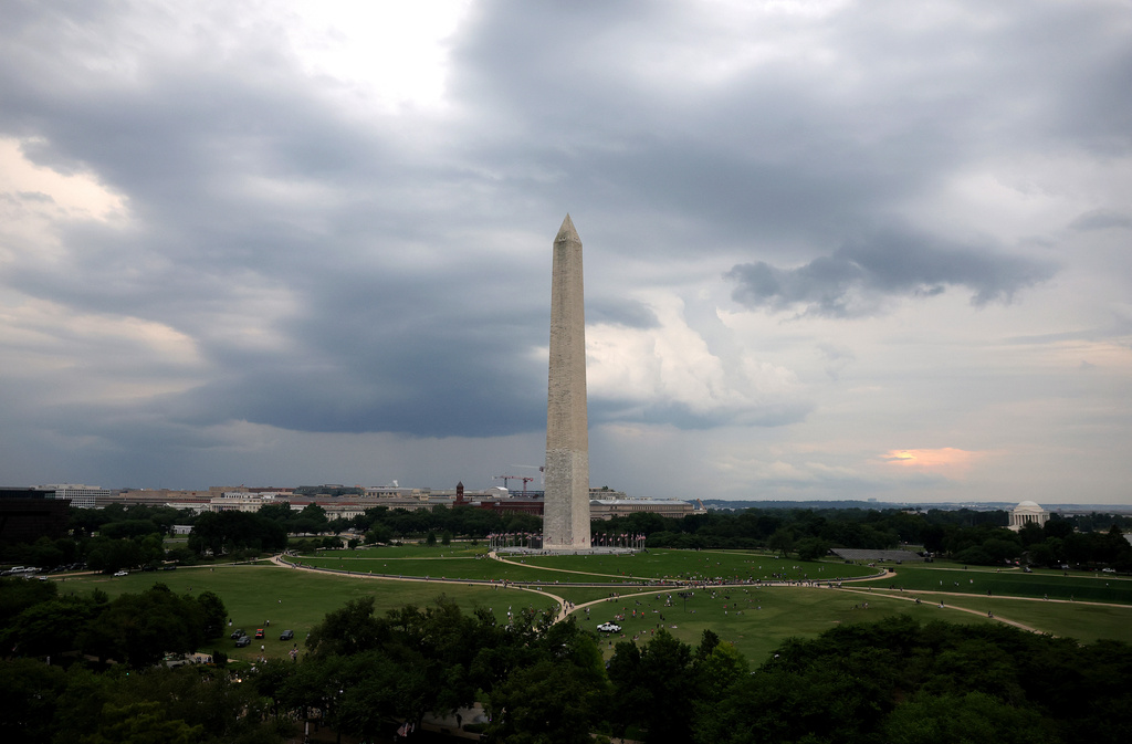 Storm clouds move above the Washington Monument ahead of the UFC Freedom 250 fight on the South Lawn of the White House on Sunday, June 14, 2026, in Washington. (Kevin Dietsch/Pool Photo via AP)
