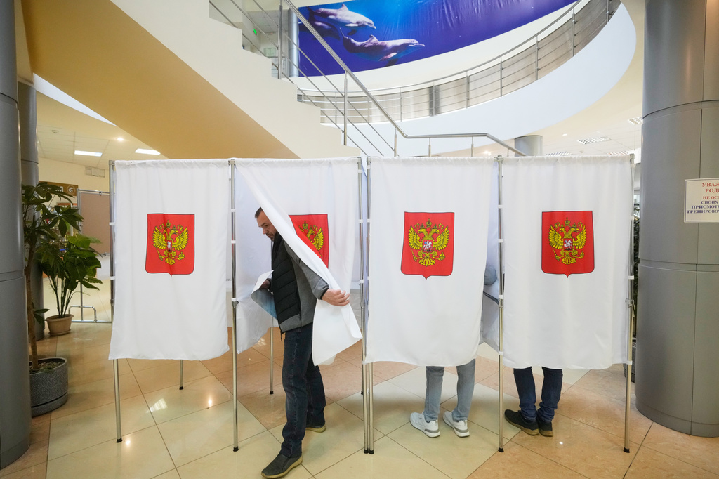 A voter leaves a polling booth after casting a vote during the parliamentary election in Podolsk, Moscow region, Russia, Saturday, Sept. 19, 2026. (AP Photo/Pavel Bednyakov)